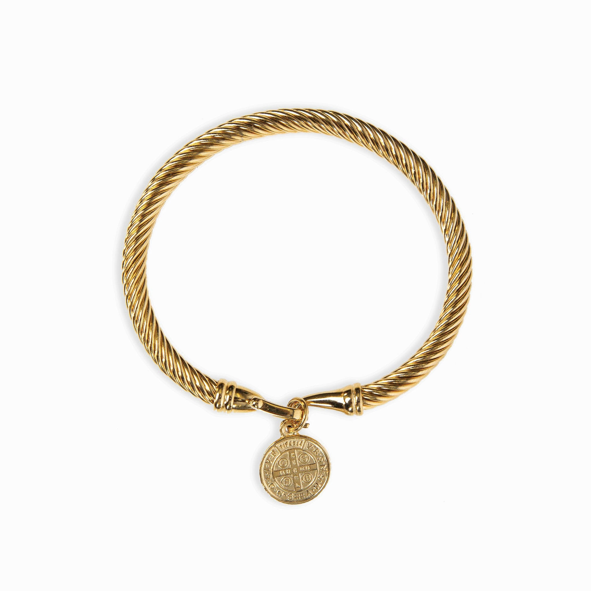 A gold-colored bracelet made of twisted metal with a coin-shaped pendant attached to one end.